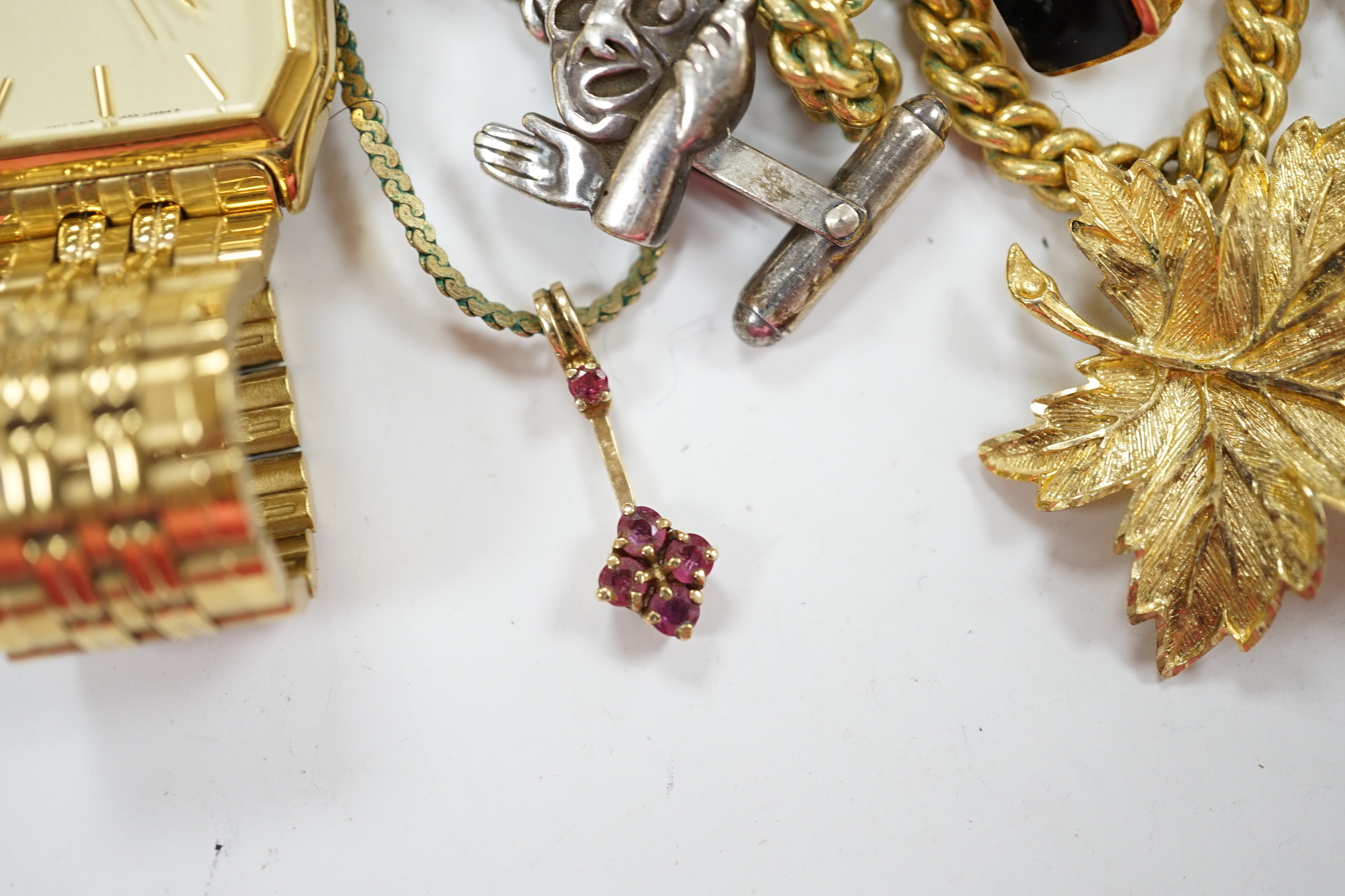 A small 9ct gold and gem set pendant, 22mm, three gilt metal chains, two white metal cufflinks, a Citizen watch, other costume jewellery and three ceramic items.